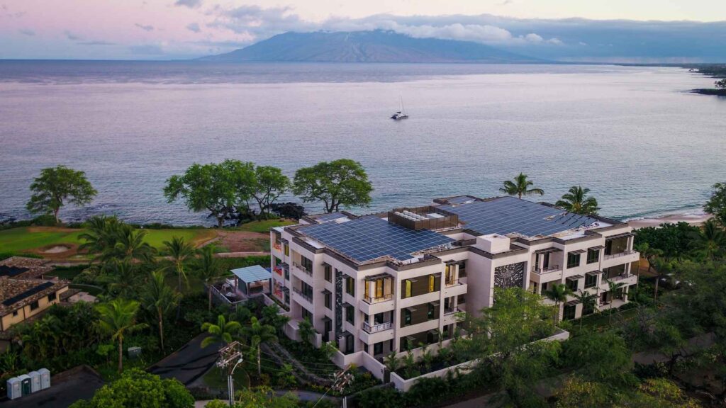 big house with solar powered roof by by the ocean and mountain from maui solar companies