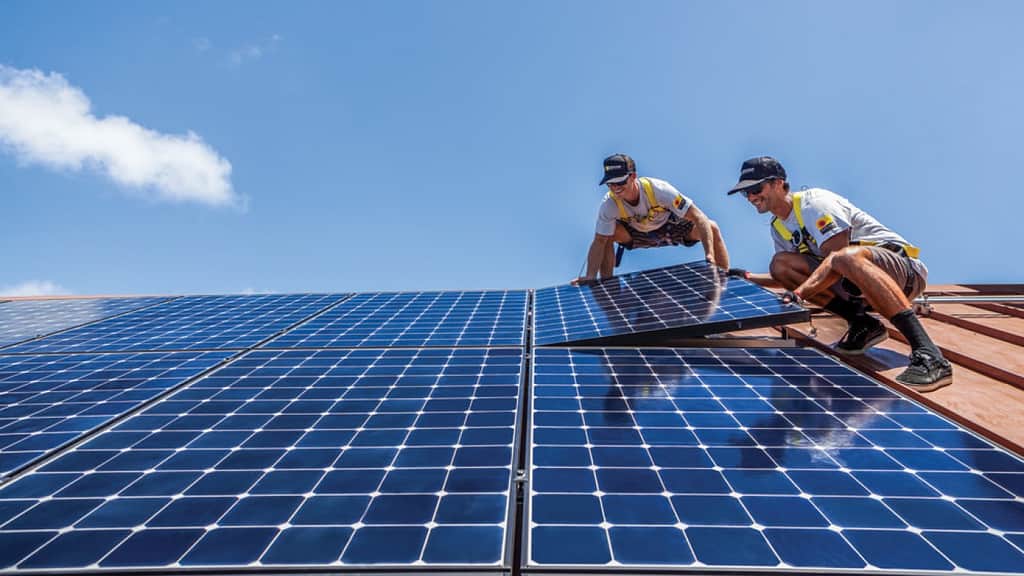 two men installing solar panels