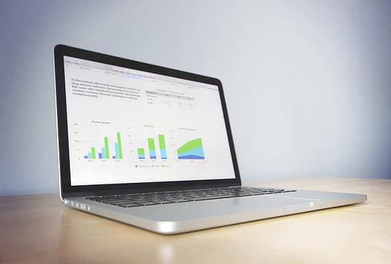 Computer showing graph of money investing in solar