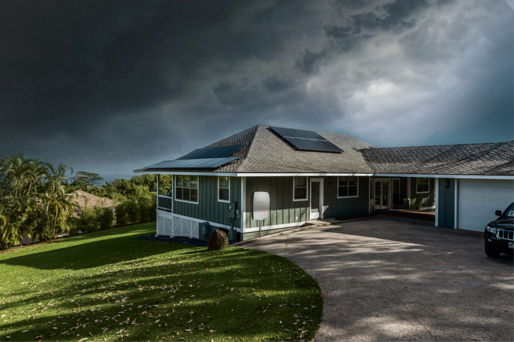 house with solar panel installed and sky that about to storm